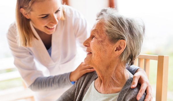 health,visitor,and,a,senior,woman,during,home,visit.